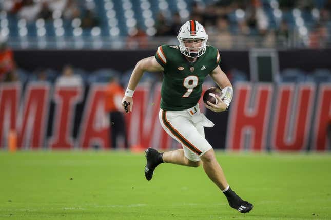 Sep 14, 2023; Miami Gardens, Florida, USA; Miami Hurricanes quarterback Tyler Van Dyke (9) runs with the football against the Bethune Cookman Wildcats during the first quarter at Hard Rock Stadium.