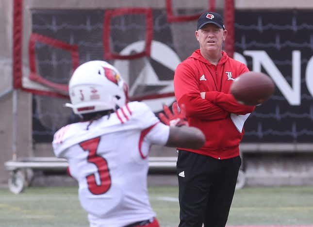 Louisville   s coach Jeff Brohm watches Kevin Coleman catch the ball on April 14, 2023 during the Cardinals&#39; final open practice before their spring game.