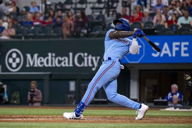 Sep 3, 2023; Arlington, Texas, USA; Texas Rangers right fielder Adolis Garcia (53) hits a walk off home run for the win over the Minnesota Twins during the ninth inning at Globe Life Field.