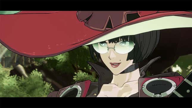 I-No, an incredibly pale woman with a beauty mark and witch's hat, stands in the woods looking past the camera.