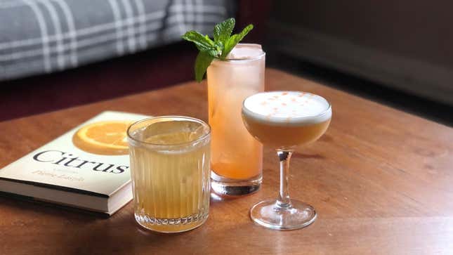 A trio of examples: A Collins with Strawberry, a Gold Rush, a whiskey sour 