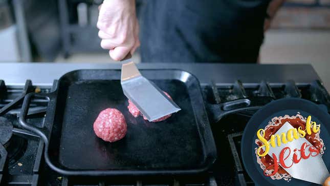Babish smashing a burger on a cast iron pan
