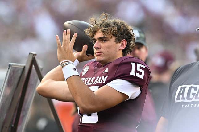 Sep 2, 2023; College Station, Texas, USA; Texas A&amp;amp;M Aggies quarterback Conner Weigman (15) warms up on the sideline during the first quarter against the New Mexico Lobos at Kyle Field.