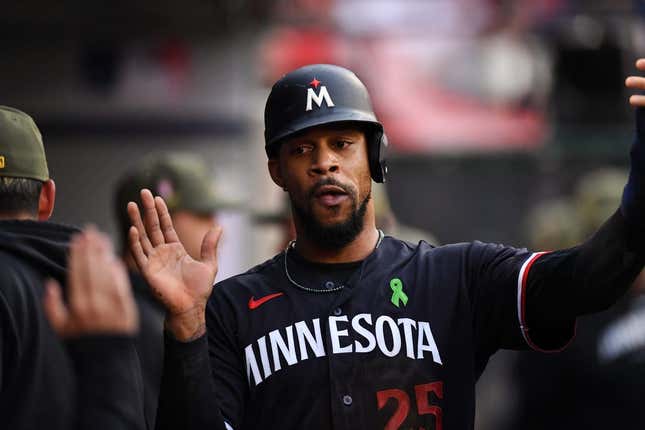 May 20, 2023; Anaheim, California, USA; Minnesota Twins designated hitter Byron Buxton (25) celebrating with teammates in the dugout against Los Angeles Angels during the first inning at Angel Stadium.