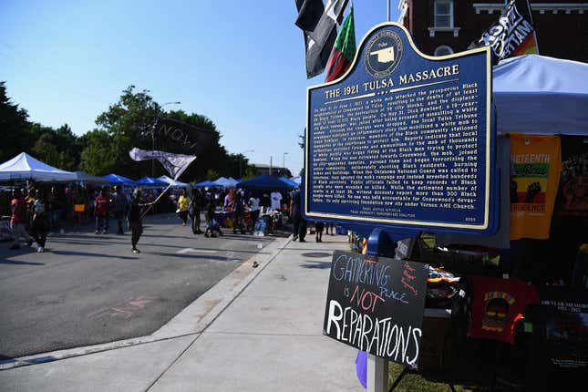 TULSA, OK - JUNE 19: An historical marker in the dedication of the 1921 Tulsa Massacre is seen during the Juneteenth Festival on June 19, 2021, in Tulsa, Oklahoma. Juneteenth celebrations, now recognized as a federal holiday, are taking place around the country to recognize the emancipation of enslaved African-American people.