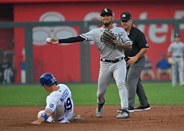 Sep 6, 2023; Kansas City, Missouri, USA;  Chicago White Sox second baseman Lenyn Sosa (50) throws the ball to first base for a double play over Kansas City Royals Michael Massey (19) in the second inning at Kauffman Stadium.