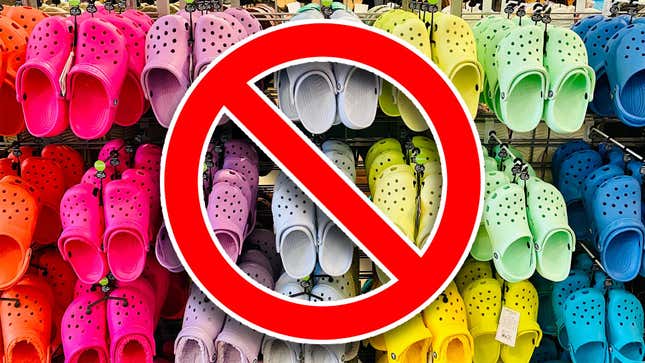 A photo shows Crocs hanging in a store with a red banned symbol in front of them all. 
