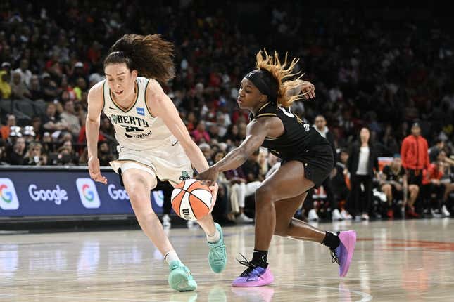 Aug 15, 2023; Las Vegas, Nevada, USA; New York Liberty forward Breanna Stewart (30) has the ball stripped by Las Vegas Aces guard Jackie Young (0) during the second quarter at Michelob Ultra Arena.