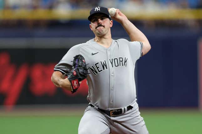 Aug 27, 2023; St. Petersburg, Florida, USA;  New York Yankees starting pitcher Carlos Rodon (55) throws a pitch against the Tampa Bay Rays in the first inning at Tropicana Field.