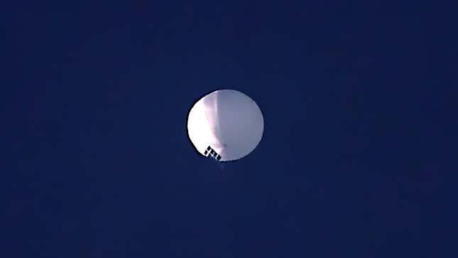 A photo of the giant white balloon from China floating in the sky in Montana.