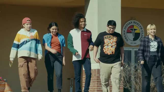A screenshot from the Reservation Dogs season 3 trailer of the cast of kids walking together out of a health clinic, smiling and joking