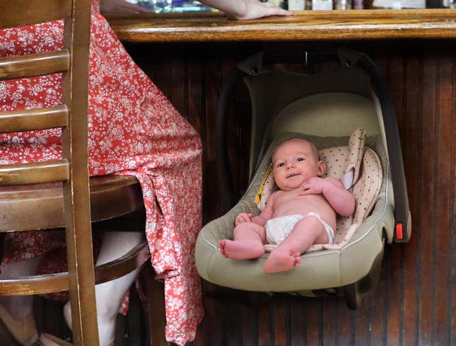 Image for article titled Baby Carrier Hung On Hook Under Bar