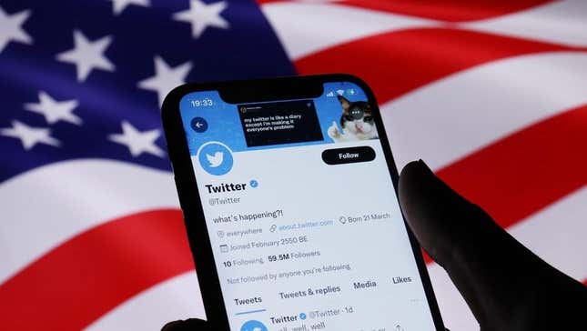The Twitter app on a cellphone in front of the American flag
