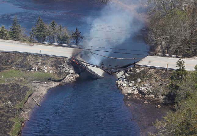A collapsed bridge between the Clyde River and Port Clyde as wildfires burn in Nova Scotia, on May 31, 2023. 