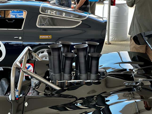 The black, uneven intake velocity stacks of a Shadow Can-Am car