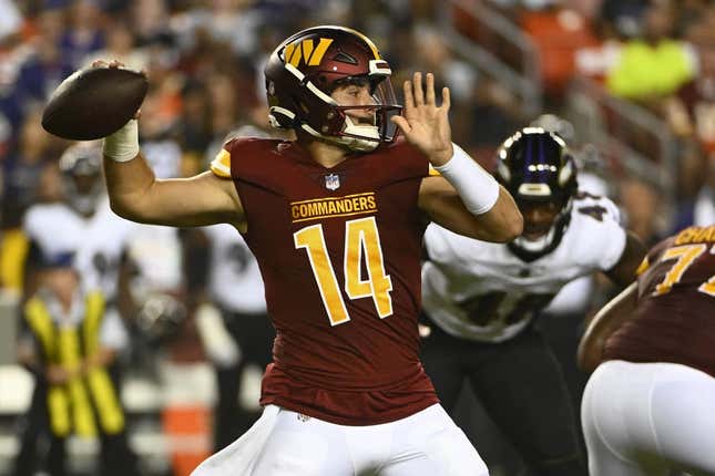 Aug 21, 2023; Landover, Maryland, USA; Washington Commanders quarterback Sam Howell (14) attempts a pass against the Baltimore Ravens during the first half at FedExField.