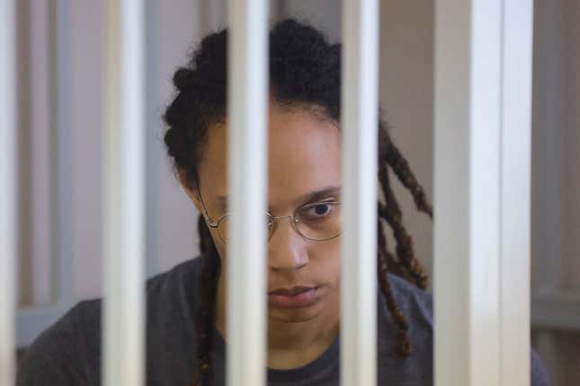 Brittney Griner waits for the verdict inside a defendants’ cage during a hearing in Khimki outside Moscow, on August 4, 2022. 