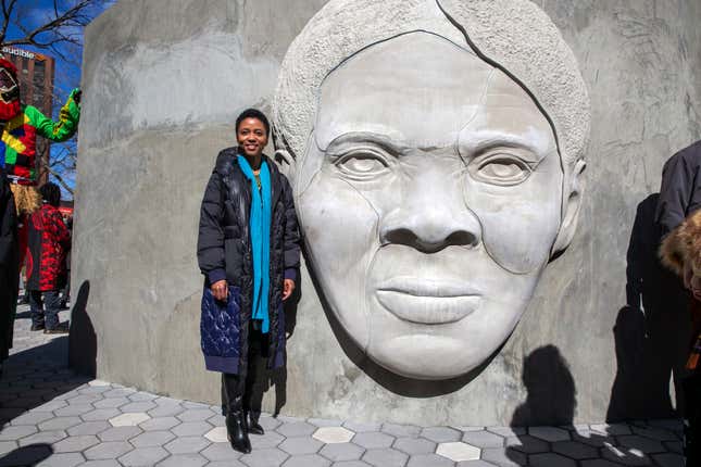 Architect Nina Cooke John stands with the Harriet Tubman monument she designed titled “Shadow of a Face,” in Newark, N.J.
