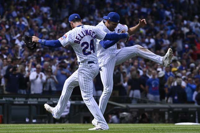 Aug 30, 2023; Chicago, Illinois, USA; Chicago Cubs center fielder Cody Bellinger (24) and second baseman Christopher Morel (5) celebrate  after beating the Milwaukee Brewers at Wrigley Field.