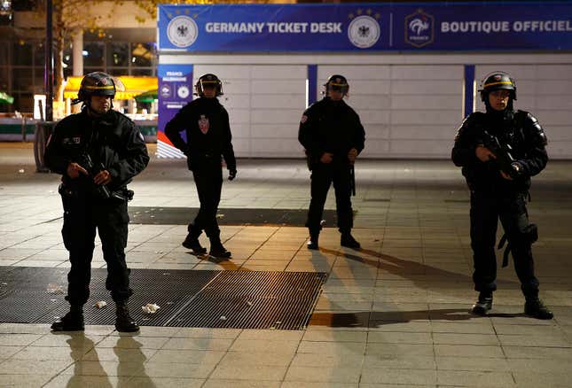 Police stand outside the Stade de France.