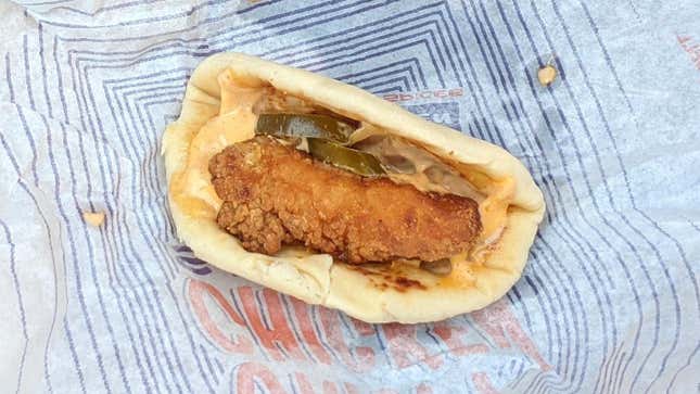 Taco Bell's Crispy Chicken Sandwich Taco sitting on wrapper
