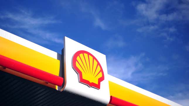 The Shell logo at a gas station.
