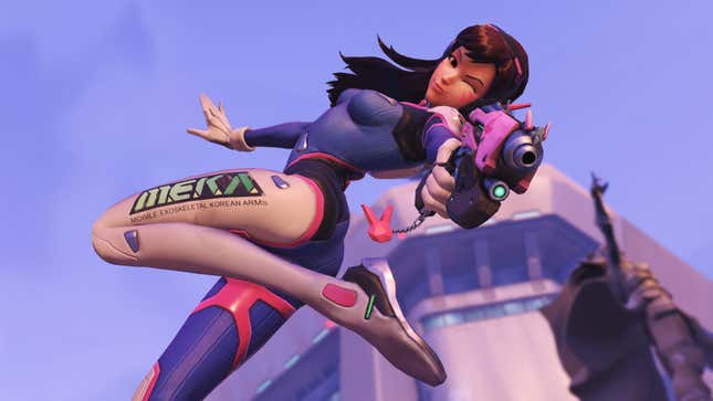 Overwatch's D.Va out of her mech, pointing a gun and winking at the camera.