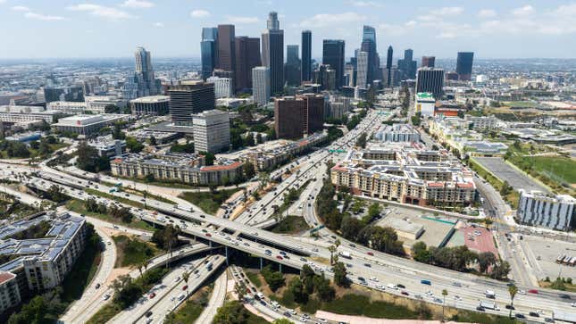  Los Angeles skyline and the four-level interchange where the 110 and 101 freeways meet. Photographed in Los Angeles, CA on Friday, June 23, 2023. 