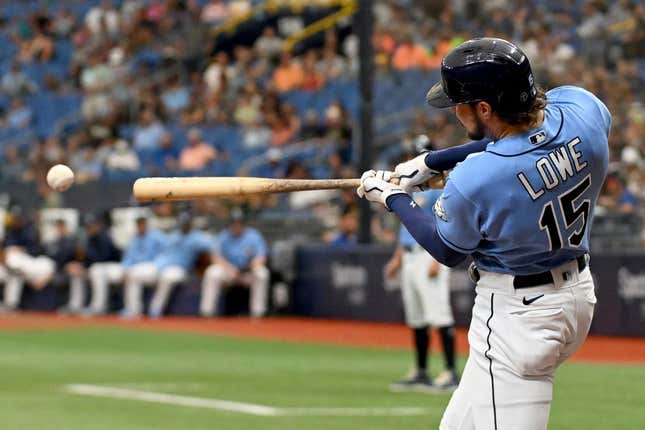 Sep 10, 2023; St. Petersburg, Florida, USA; Tampa Bay Rays right fielder Josh Lowe (15) hits a RBI double in the first inning against the Seattle Mariners  at Tropicana Field.