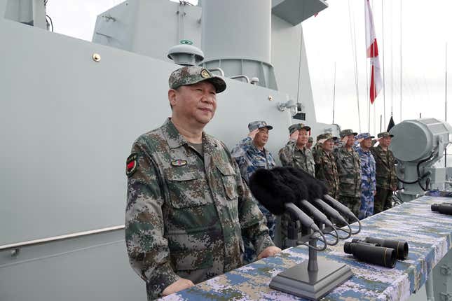 Chinese President Xi Jinping delivers a speech as he reviews a military display of Chinese People's Liberation Army (PLA) Navy in the South China Sea April 12, 2018. Picture taken April 12, 2018.