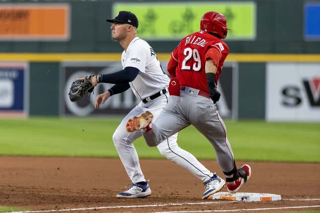 Sep 13, 2023; Detroit, Michigan, USA; Cincinnati Reds center fielder TJ Friedl (29) beats the throw to Detroit Tigers first baseman Spencer Torkelson (20) in the fourth inning at Comerica Park.