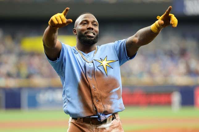 Aug 27, 2023; St. Petersburg, Florida, USA;  Tampa Bay Rays left fielder Randy Arozarena (56) reacts after scoring a run against the New York Yankees in the first inning at Tropicana Field.
