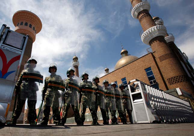 Paramilitary police stand guard across the entrance to a large mosque in the centre of Urumqi, July 9, 2009.