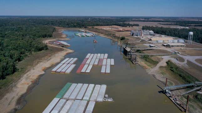 In this aerial view, barges, stranded by low water sit at the Port of Rosedale along the Mississippi River on October 20, 2022 in Rosedale, Mississippi. The lion fossil was found in the Rosedale area in October.