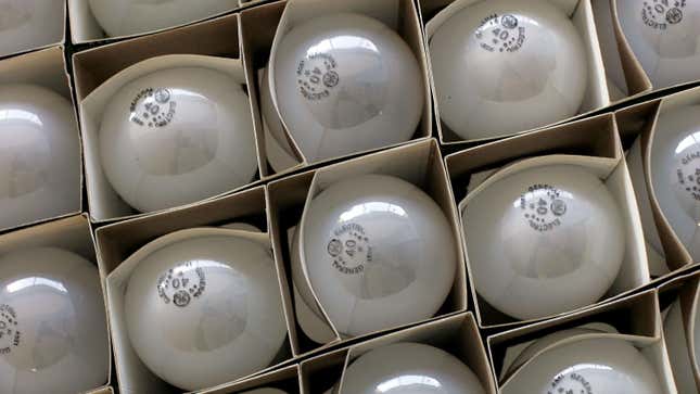 Boxes of incandescent light bulbs piled on top of each other.