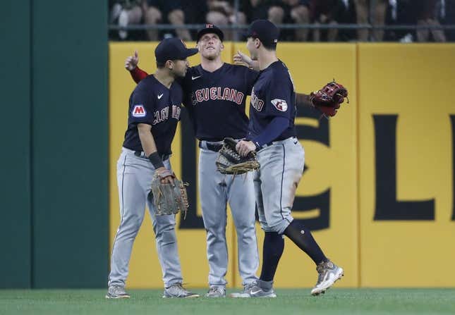 Jul 17, 2023; Pittsburgh, Pennsylvania, USA;  Cleveland Guardians left fielder Steven Kwan (left) and center fielder Myles Straw (middle) and right fielder David Fry (right) celebrate in the outfield after defeating the Pittsburgh Pirates at PNC Park. The Guardians shutout the Pirates 11-0.