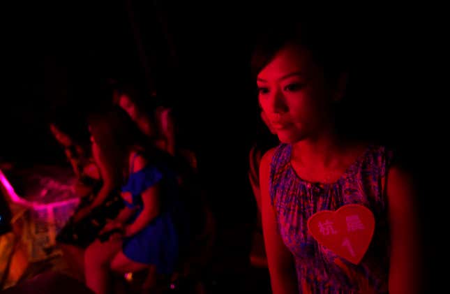 A woman waits backstage before the taping of a dating show, “Meet you on Saturday,” in Shanghai.