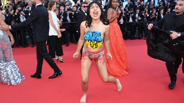 Image for article titled Activist Crashes Cannes Red Carpet to Protest Rape in Ukraine