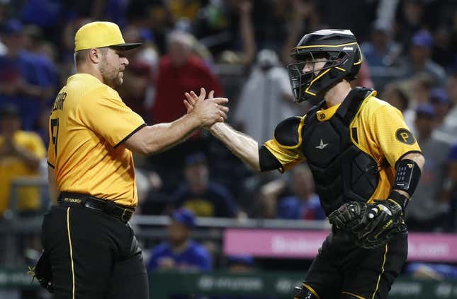 Aug 25, 2023; Pittsburgh, Pennsylvania, USA; Pittsburgh Pirates relief pitcher David Bednar (51) and catcher Jason Delay (55) shake hands after defeating the Chicago Cubs at PNC Park. Pittsburgh won 2-1.