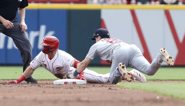 Sep 10, 2023; Cincinnati, Ohio, USA; Cincinnati Reds third baseman Spencer Steer (7) is tagged out at second base against St. Louis Cardinals second baseman Tommy Edman (19) during the second inning at Great American Ball Park.