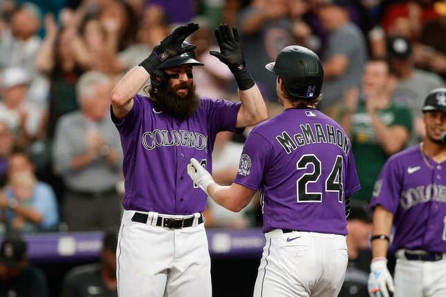 Elias Diaz of the Colorado Rockies celebrates with Brendan Rodgers