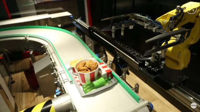 Bucket of KFC fried chicken on robotic conveyor belt
