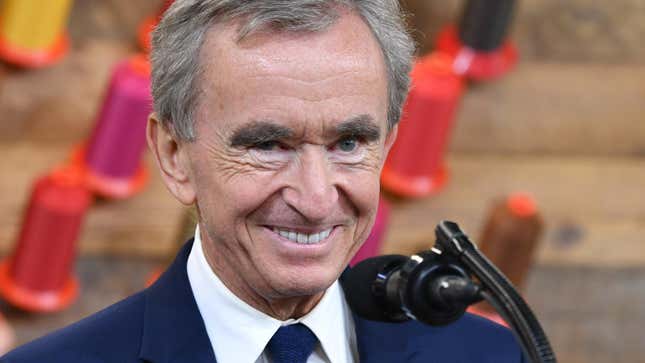 Bernard Arnault Smiling in front of a microphone