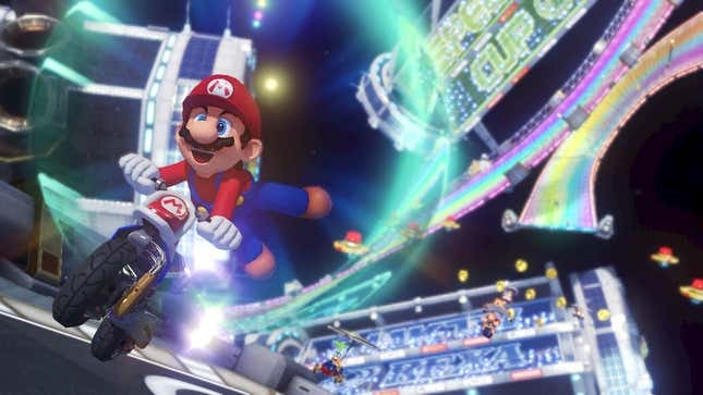 Mario kicks his feet in the air while riding a motorcycle. 