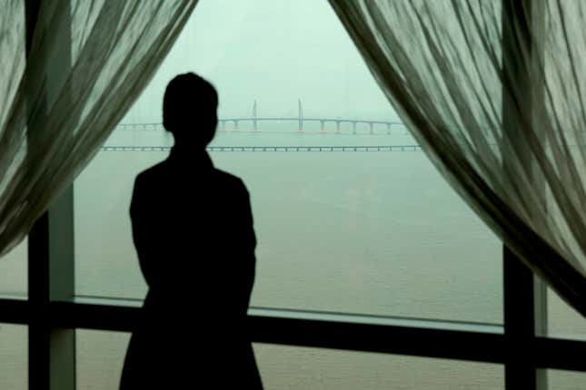 The Hong Kong-Zhuhai-Macau bridge is seen from a rooftop pool in Zhuhai, China.