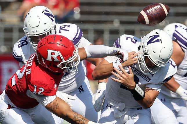 Sep 3, 2023; Piscataway, New Jersey, USA; Rutgers Scarlet Knights defensive lineman Kenny Fletcher (12) forces a fumble by Northwestern Wildcats quarterback Ben Bryant (2) during the second half at SHI Stadium.