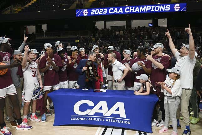 Mar 7, 2023; Washington, D.C., USA;  Colonial Athletic Association commissioner Joe D&#39;Antonio presents Charleston Cougars head coach Pat Kelsey the conference championship trophy after defeating North Carolina-Wilmington Seahawks  at Entertainment &amp;amp; Sports Arena.