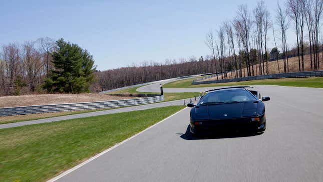 A photo of a Lamborghini racing on a track in New York. 