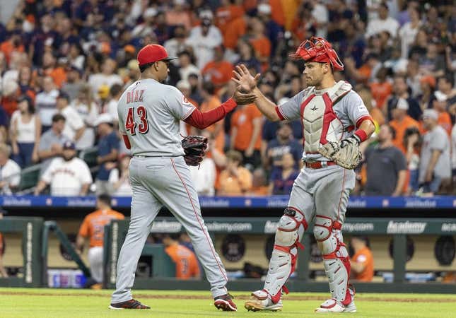 Jun 16, 2023; Houston, Texas, USA;  Cincinnati Reds relief pitcher Alexis Diaz (43) and  catcher Luke Maile (22) celebrate the win agains the Houston Astros  at Minute Maid Park.