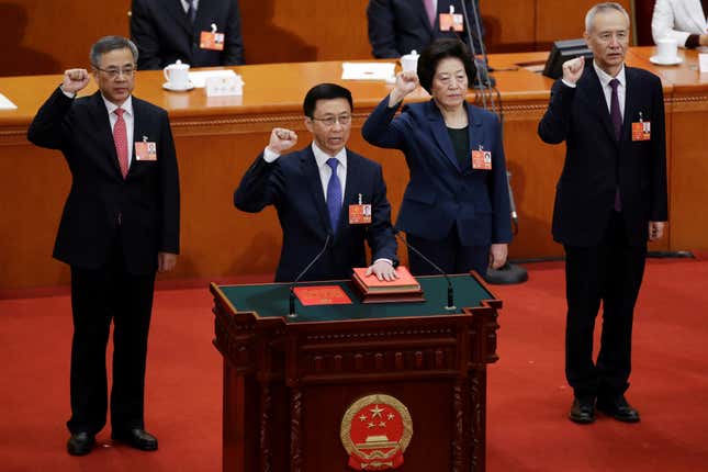 Newly elected Vice Premiers (L-R) Hu Chunhua, Han Zheng, Sun Chunlan and Liu He take an oath to the constitution at the seventh plenary session of the National People's Congress (NPC) at the Great Hall of the People in Beijing, China March 19, 2018.